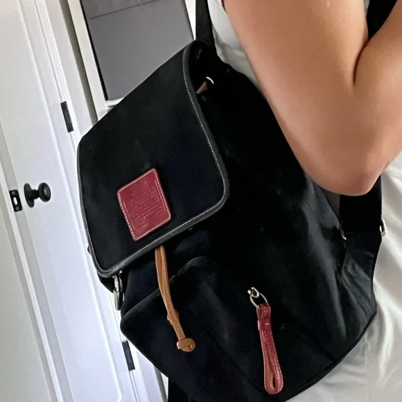 COACH canvas backpack and COACH leather wallet.